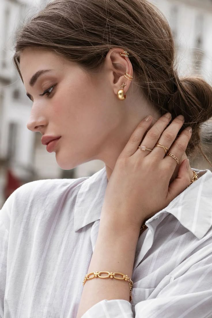 Woman wearing refined everyday gold jewellery